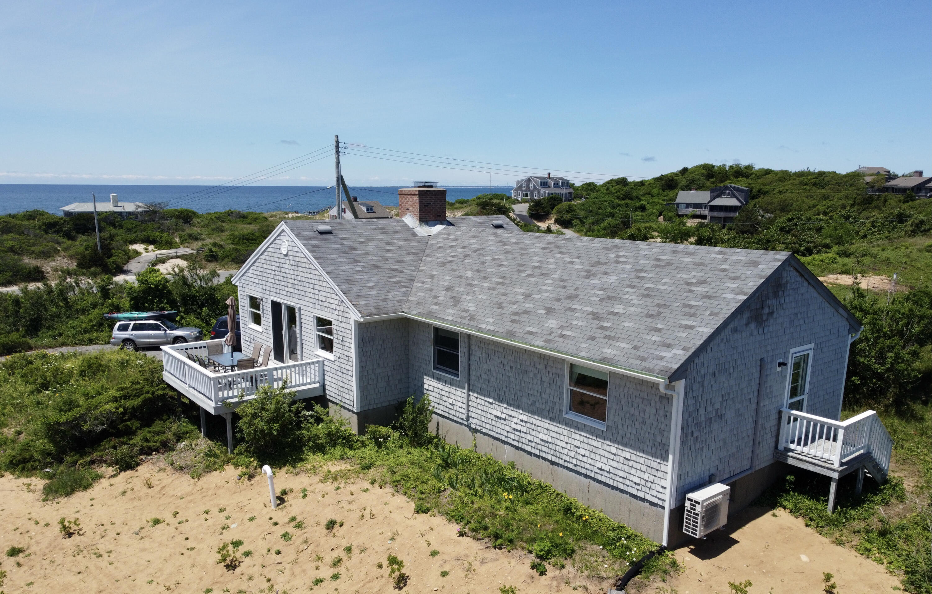 2 Ryder Hollow Road Truro, MA 02666 - Photo 2 of 33 a aerial view of a house with a yard