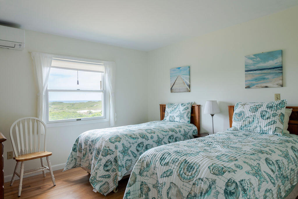 2 Ryder Hollow Road Truro, MA 02666 - Photo 23 of 33 a bedroom with two beds and a window