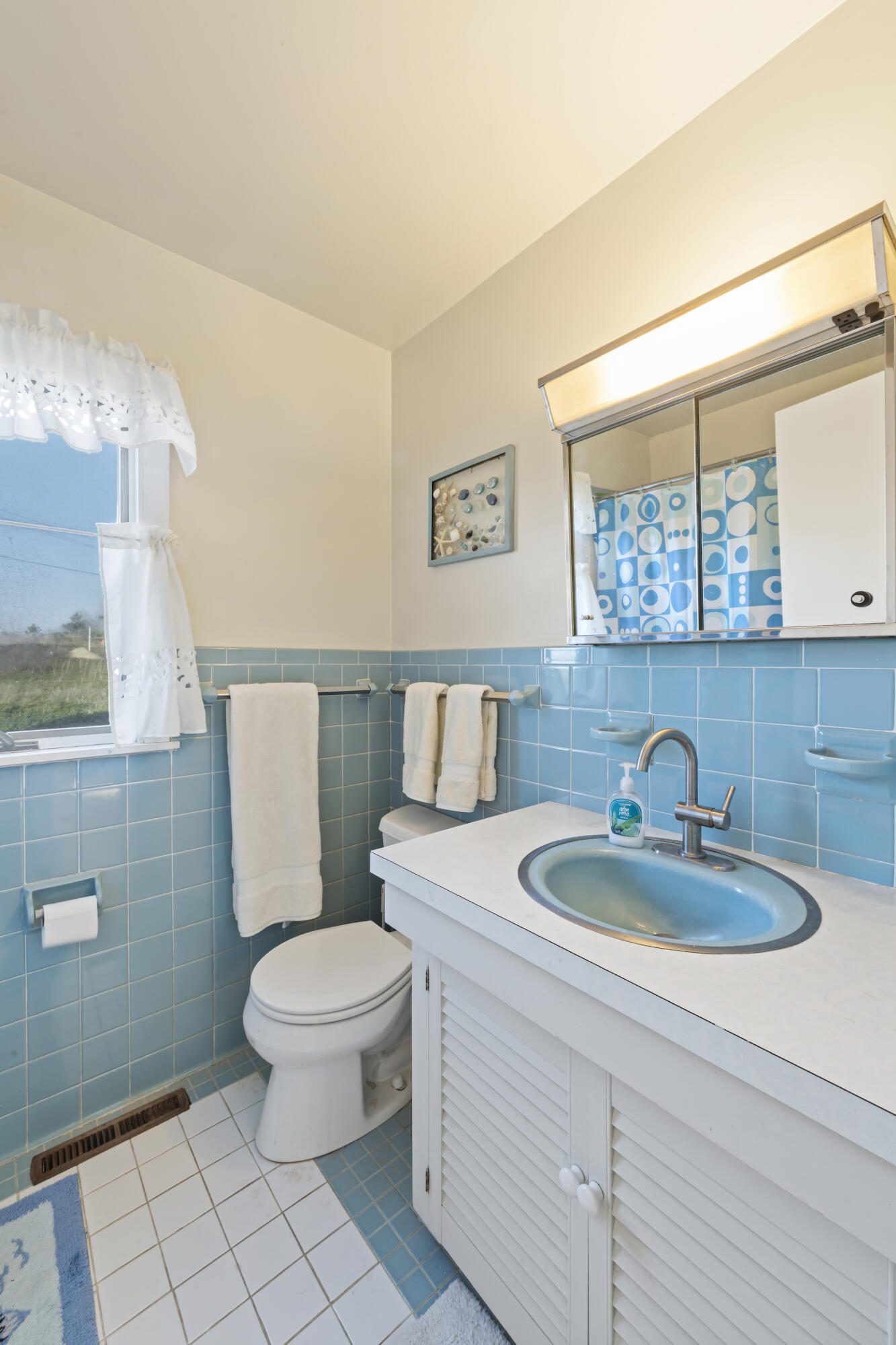2 Ryder Hollow Road Truro, MA 02666 - Photo 25 of 33 a bathroom with a toilet a sink and mirror