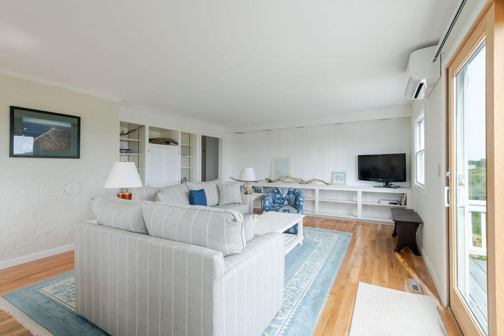 2 Ryder Hollow Road Truro, MA 02666 - Photo 10 of 33 a living room with furniture and a flat screen tv