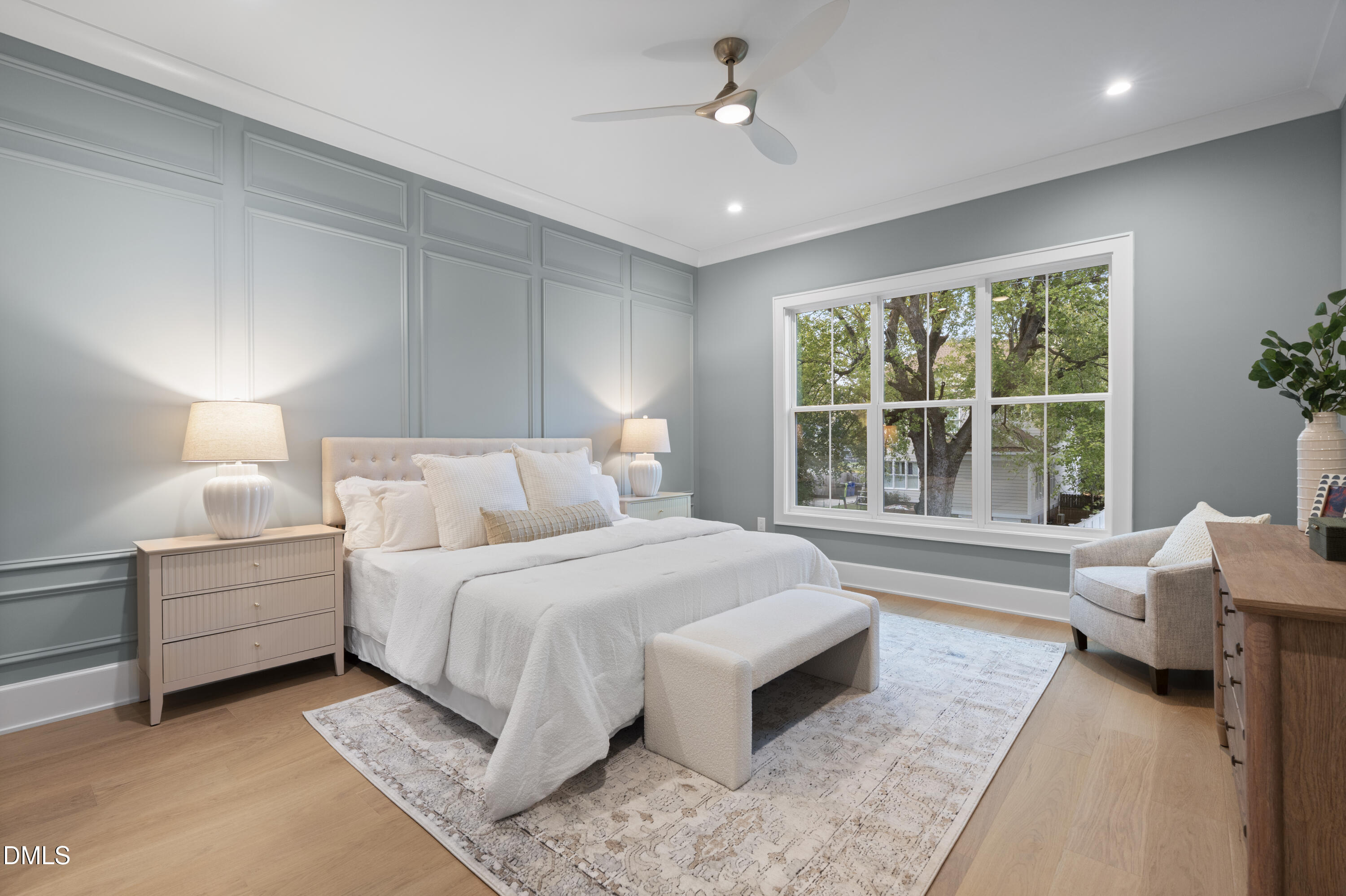 709 Mills Street Raleigh, NC 27608 - Photo 26 of 37 a spacious bedroom with a large bed and a couch