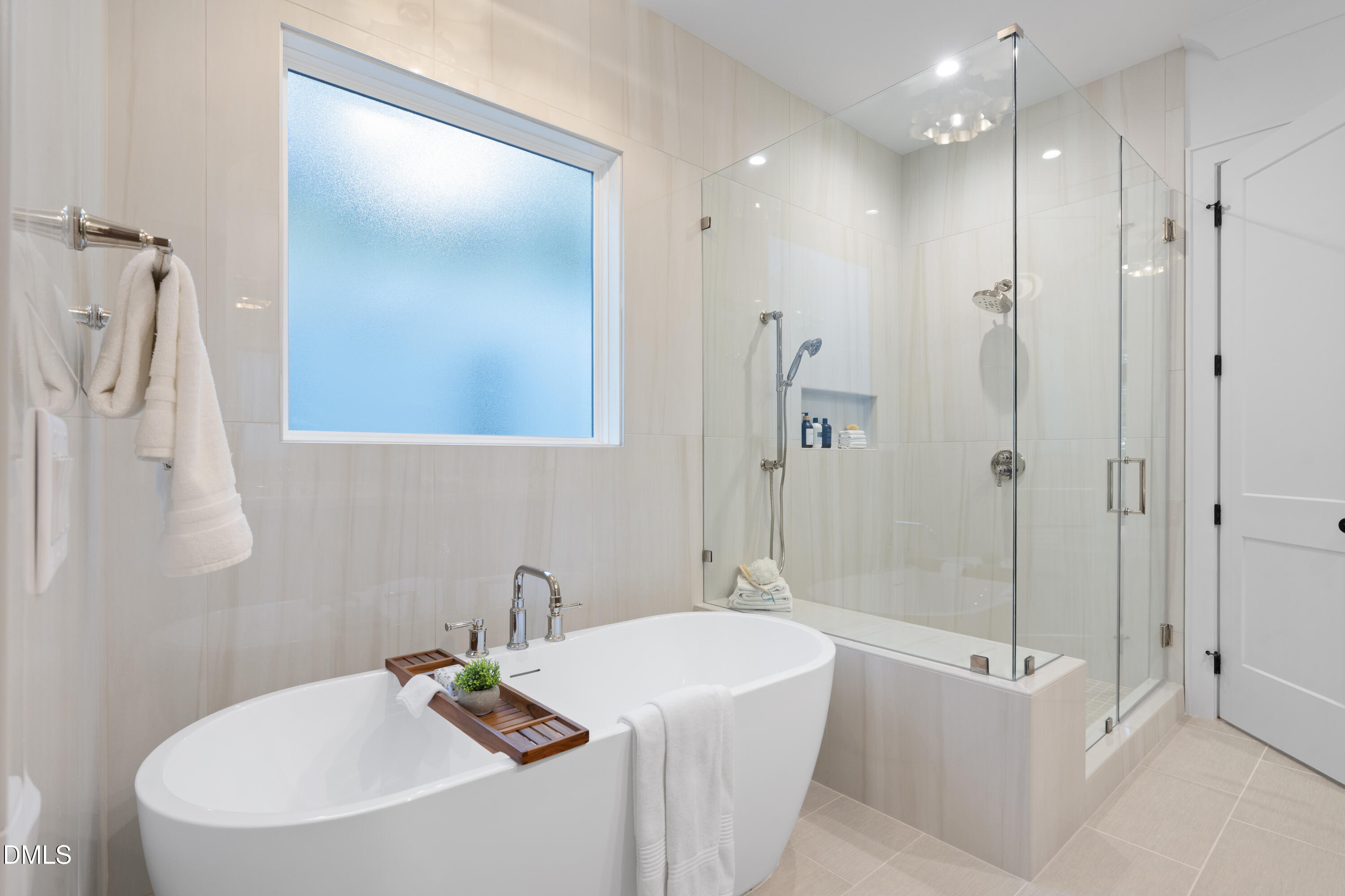 709 Mills Street Raleigh, NC 27608 - Photo 28 of 37 a bathroom with a bathtub a sink a vanity and a shower