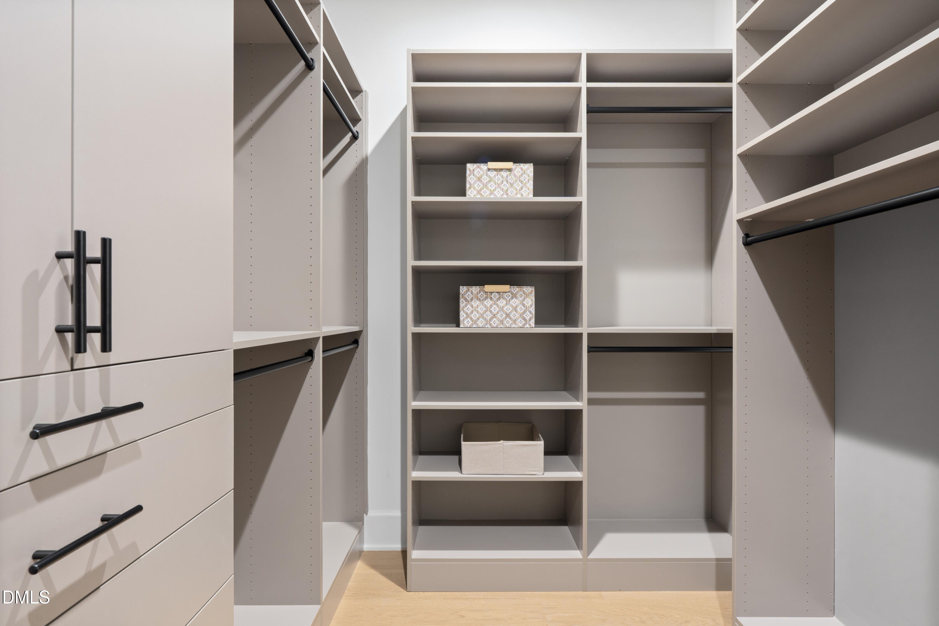 709 Mills Street Raleigh, NC 27608 - Photo 32 of 37 a view of walk in closet with empty racks