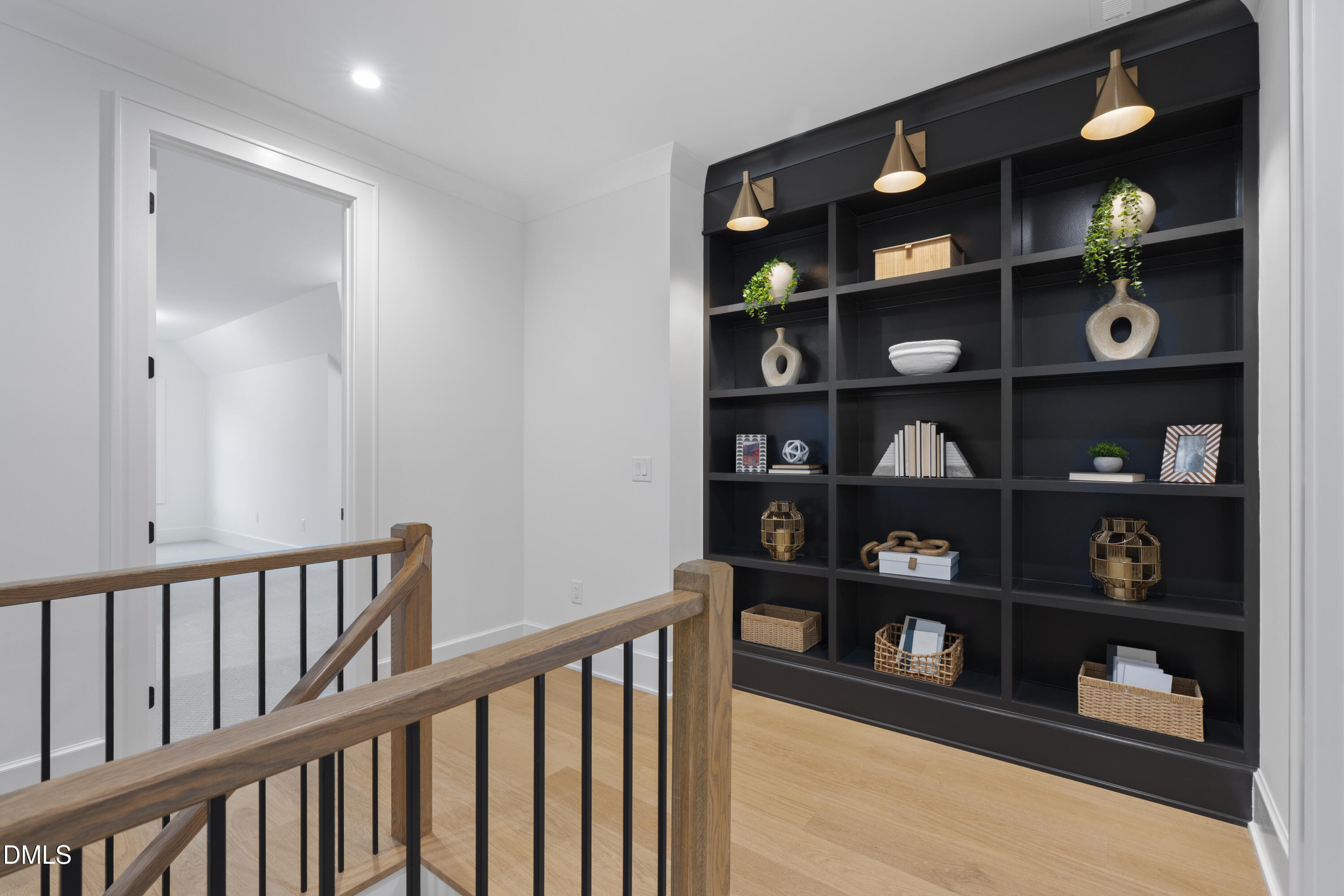 709 Mills Street Raleigh, NC 27608 - Photo 33 of 37 a view of a hallway with shelves