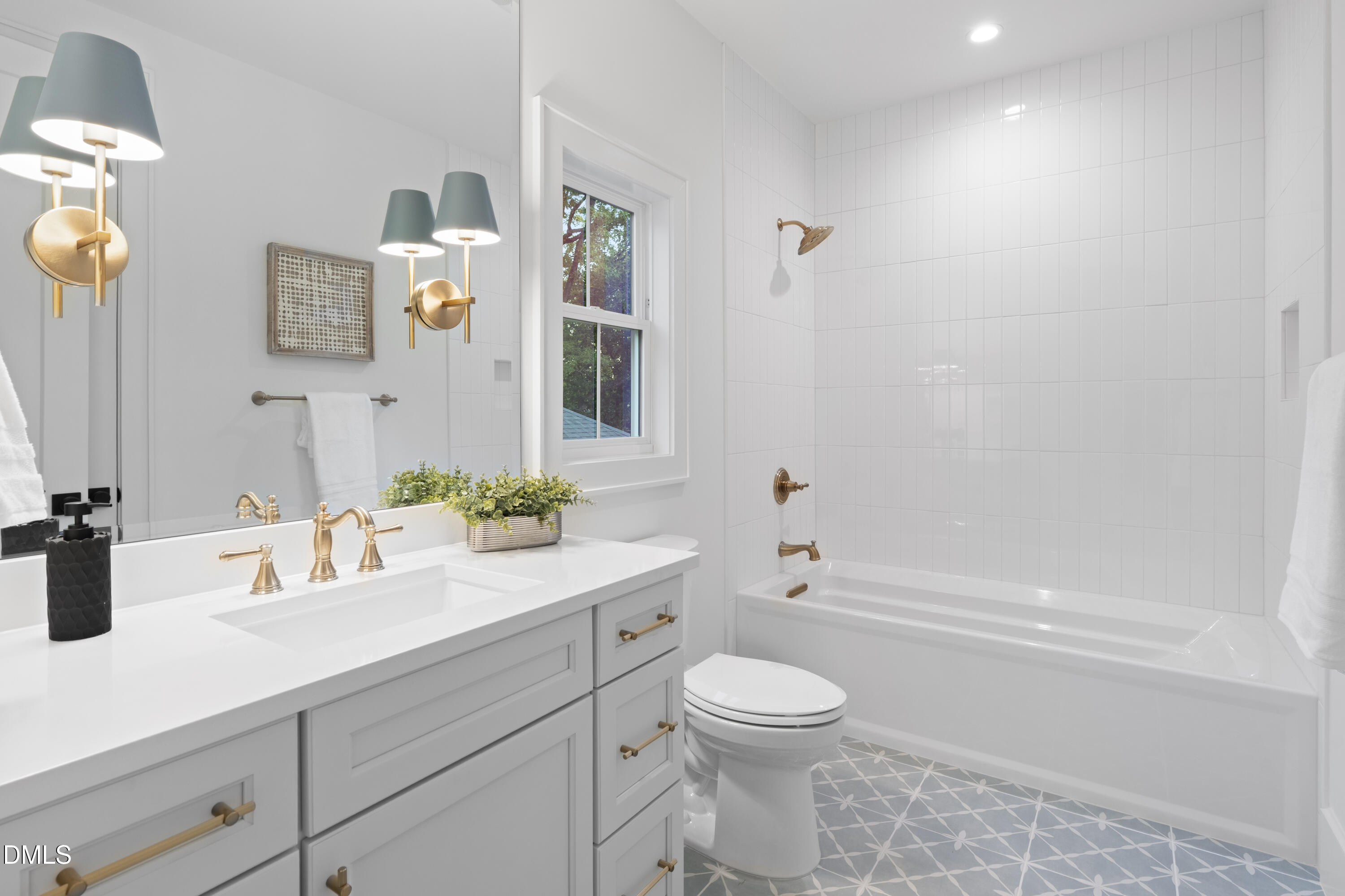 709 Mills Street Raleigh, NC 27608 - Photo 34 of 37 a bathroom with a sink a toilet and shower