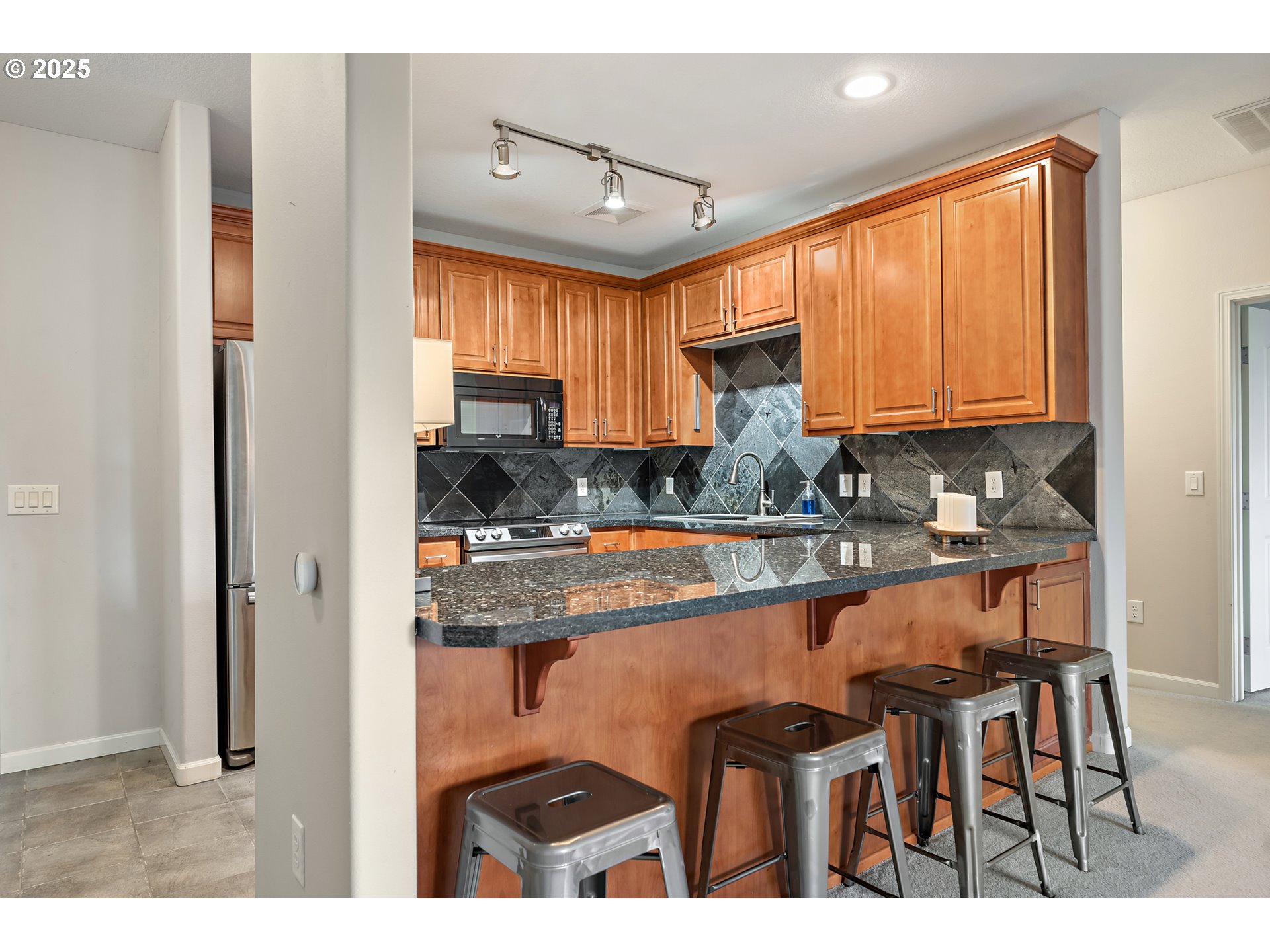 20508 Southwest Roy Rogers Road, Unit 328 Sherwood, OR 97140 - Photo 21 of 48 a kitchen with dining table and chairs