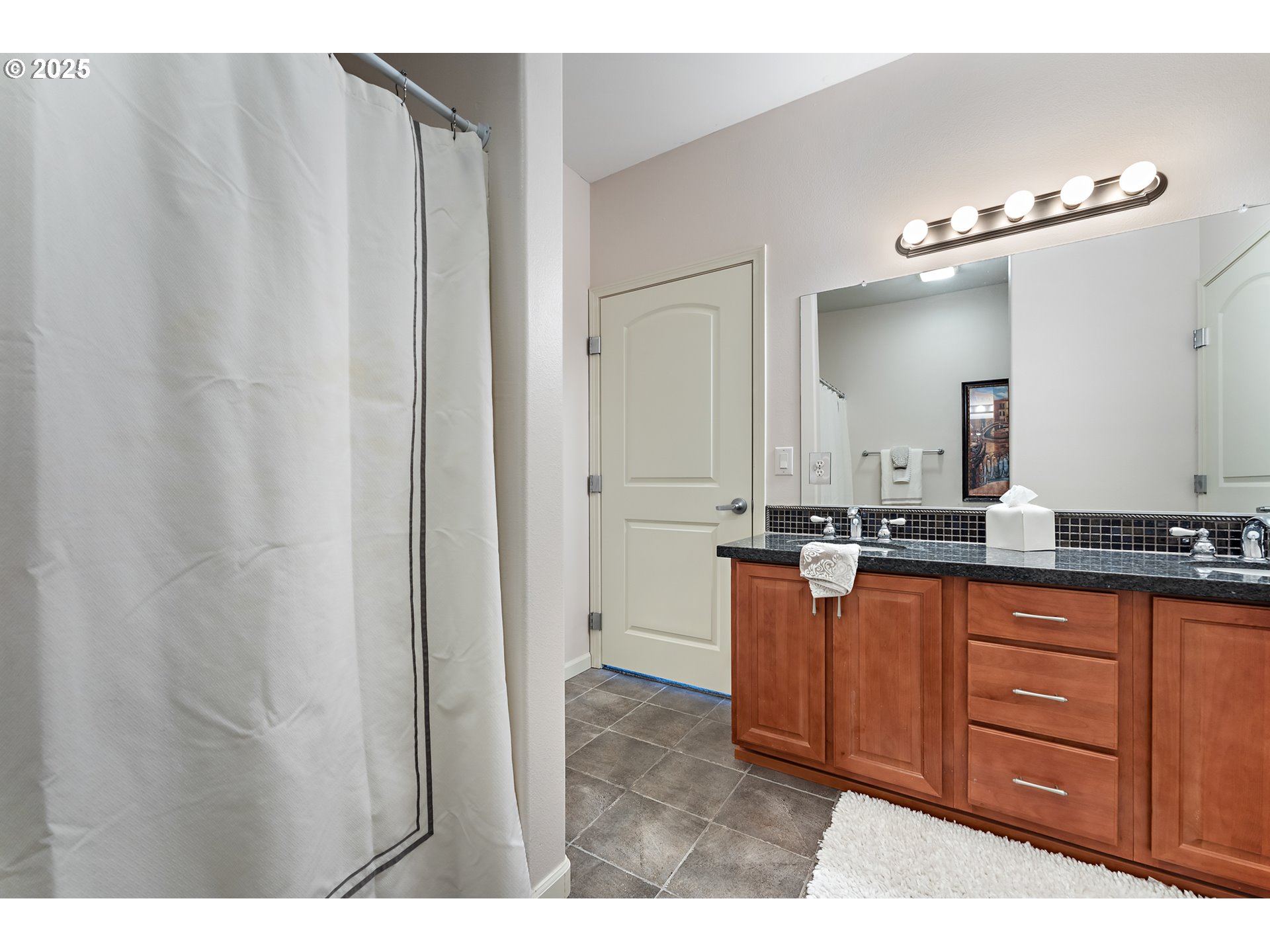 20508 Southwest Roy Rogers Road, Unit 328 Sherwood, OR 97140 - Photo 28 of 48 a bathroom with a sink and a mirror