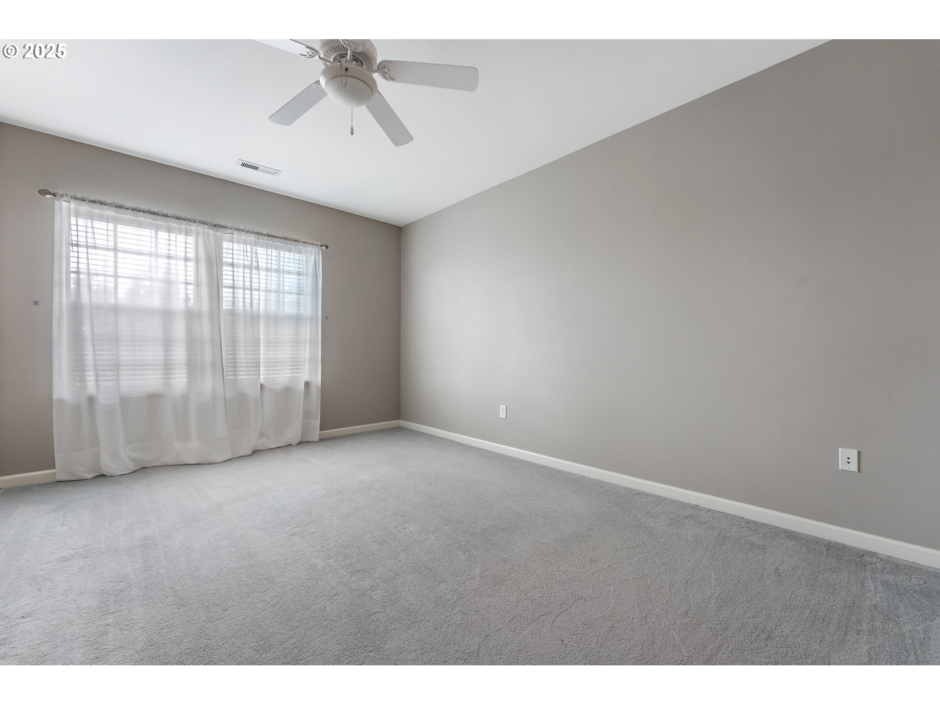20508 Southwest Roy Rogers Road, Unit 328 Sherwood, OR 97140 - Photo 30 of 48 a view of an empty room with a ceiling fan