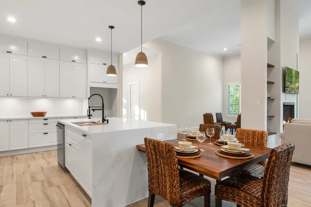 a kitchen with cabinets and window