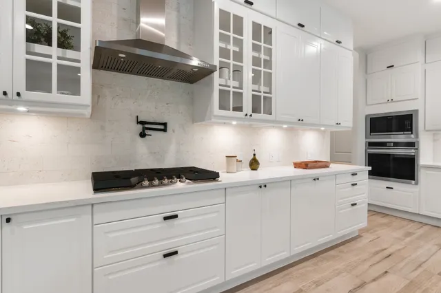 a spacious bedroom with a large bed and a large window