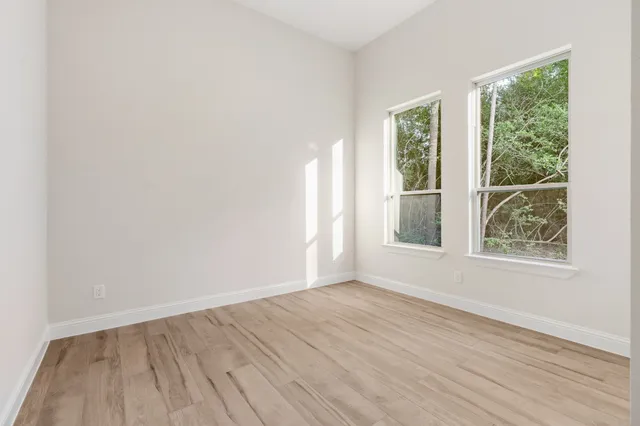 a bathroom with a toilet a sink and shower