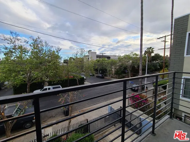 a view of a balcony with city view