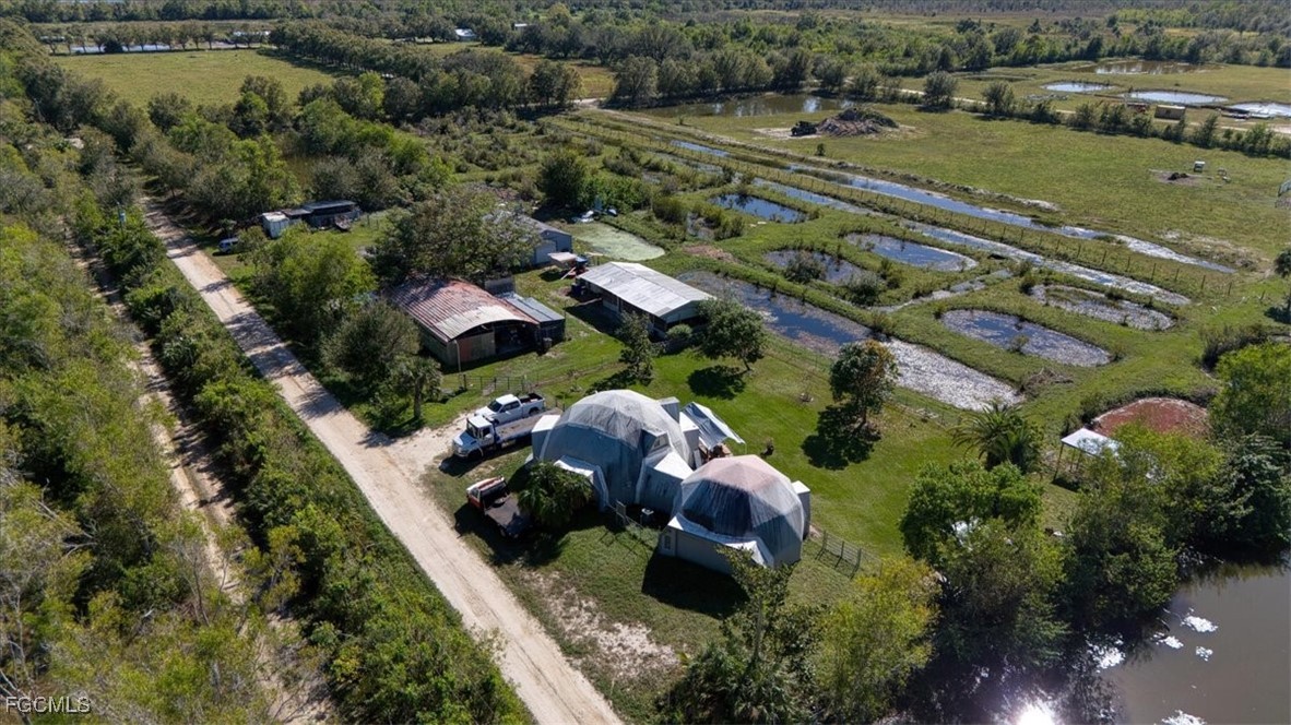 15871 Huffmaster Road North Fort Myers, FL 33917 - Photo 3 of 5 an aerial view of multiple houses with yard