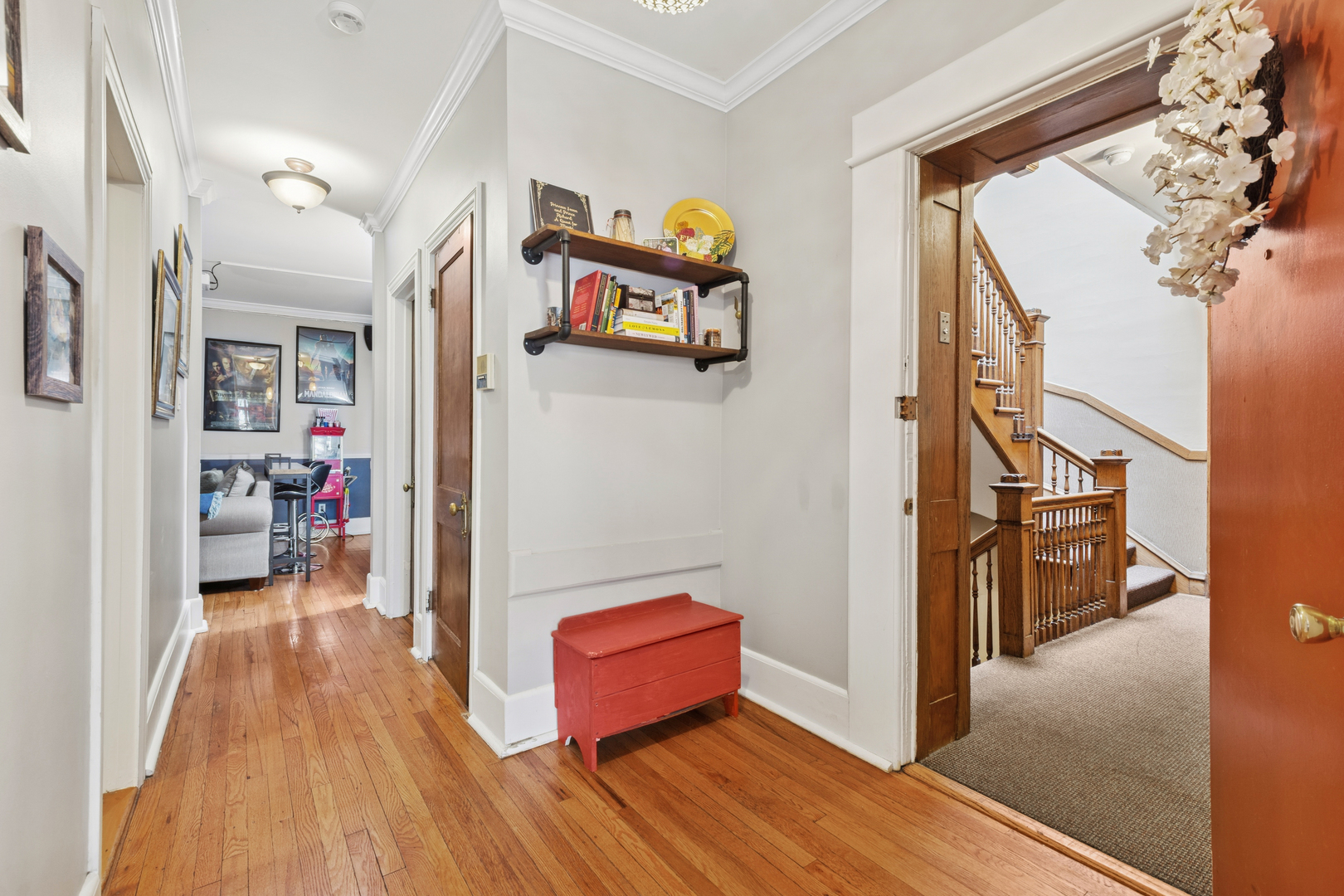 559 West Aldine Avenue, Unit 2 Chicago, IL 60657 - Photo 11 of 23 a view of a hallway with wooden floor and furniture