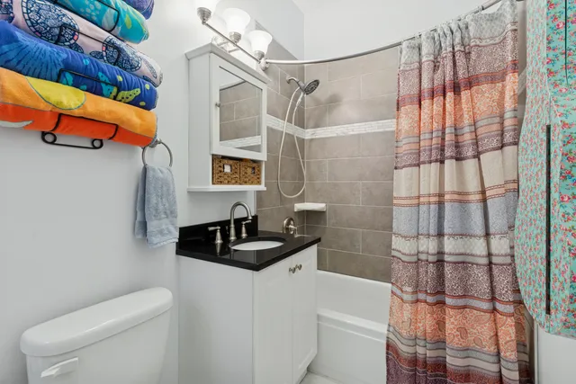 a living room with furniture and a rug