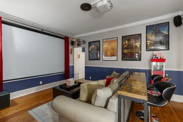 a kitchen with stainless steel appliances kitchen island granite countertop a refrigerator a stove a sink dishwasher with a dining table and chairs