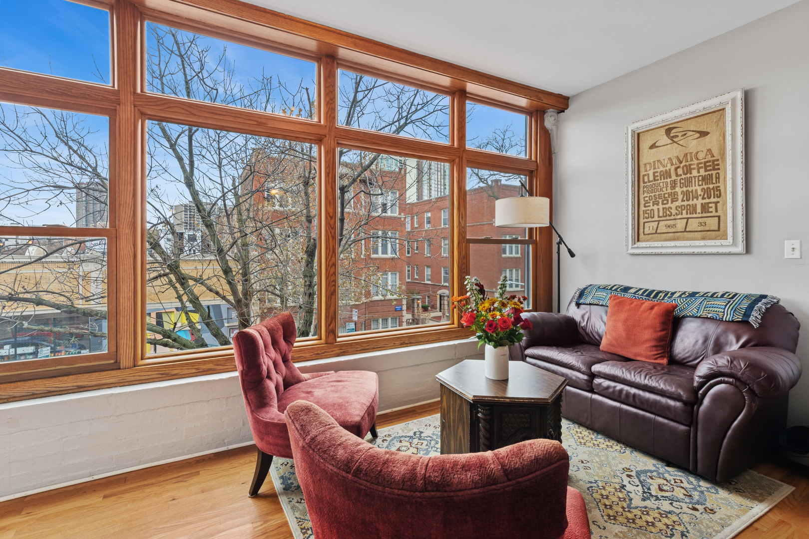 559 West Aldine Avenue, Unit 2 Chicago, IL 60657 - Photo 4 of 23 a living room with furniture and a large window