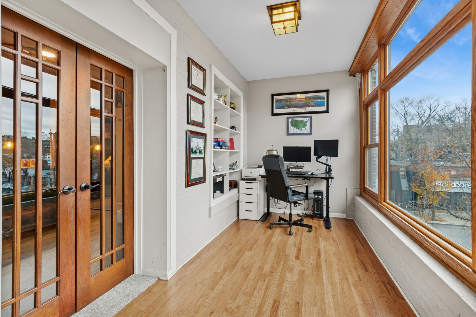 559 West Aldine Avenue, Unit 2 Chicago, IL 60657 - Photo 5 of 23 a view of a workspace with furniture and a window