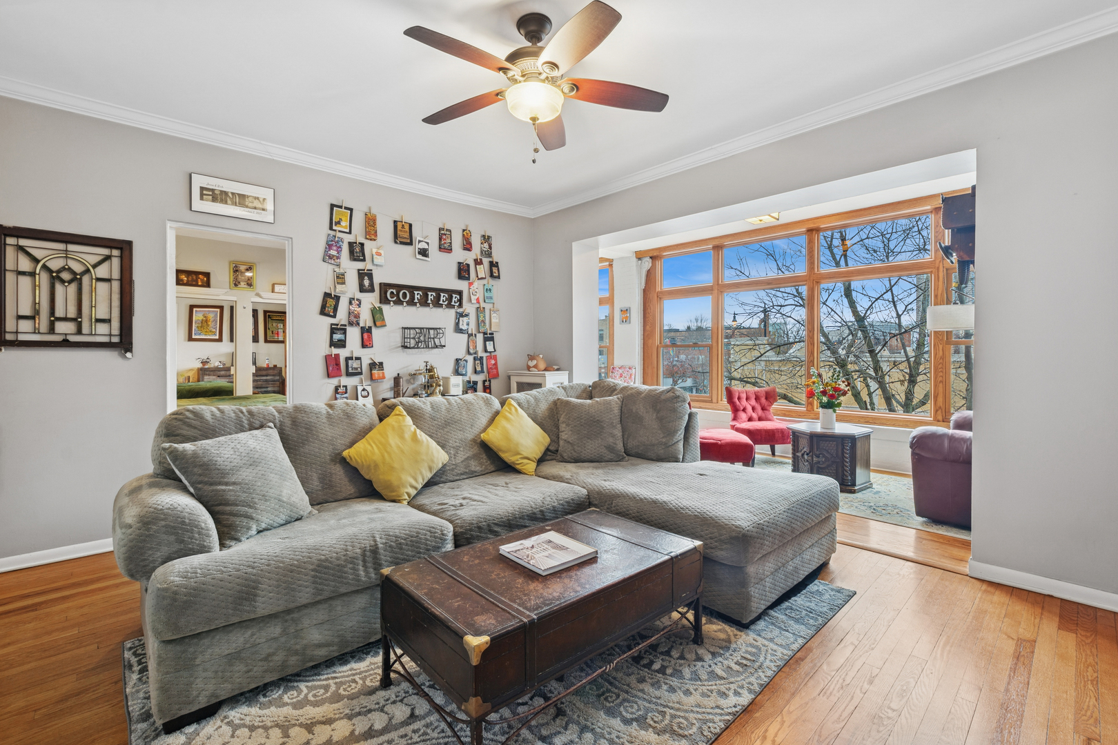 559 West Aldine Avenue, Unit 2 Chicago, IL 60657 - Photo 6 of 23 a living room with furniture and a large window
