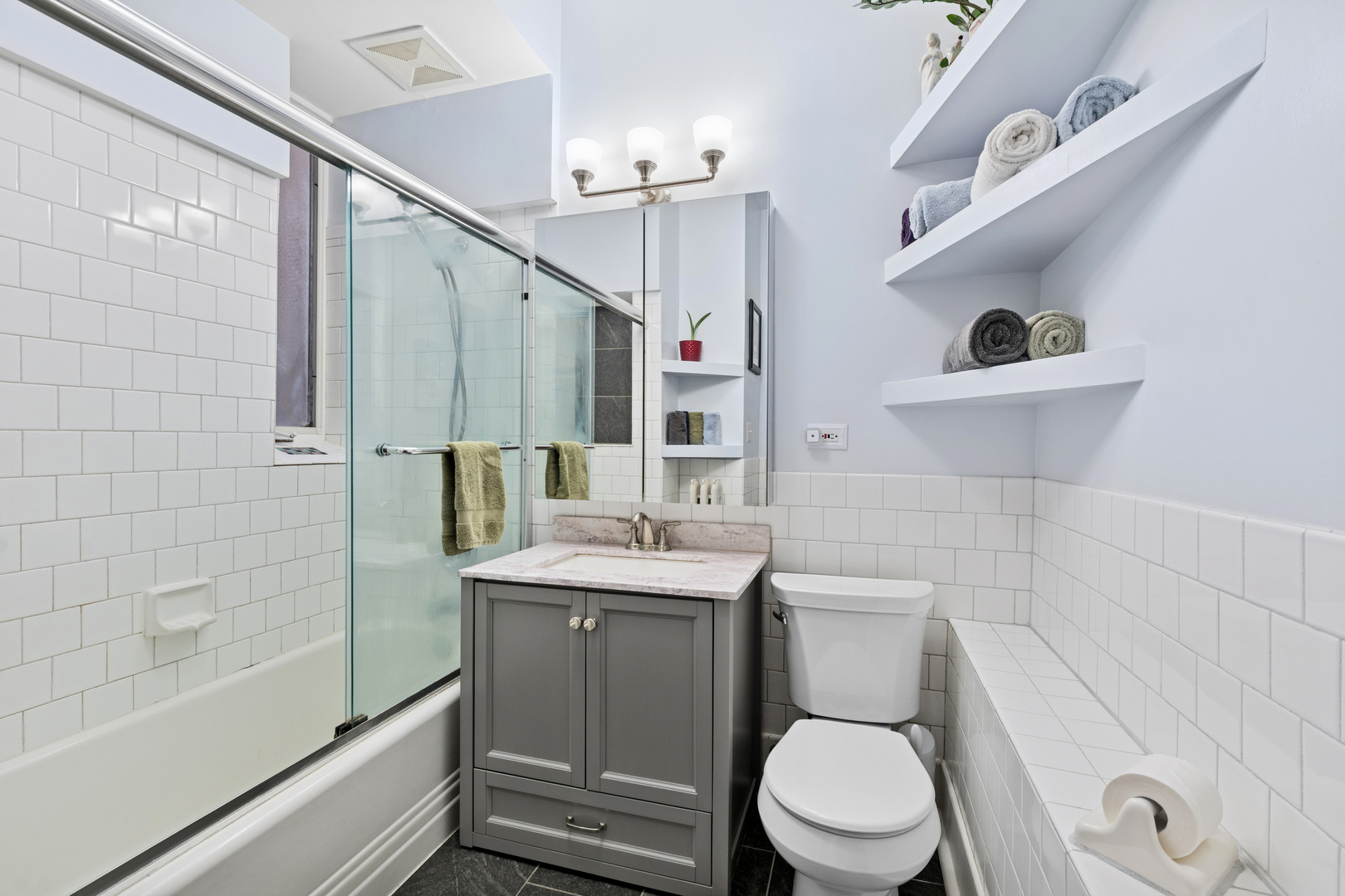 559 West Aldine Avenue, Unit 2 Chicago, IL 60657 - Photo 10 of 23 a bathroom with a sink a toilet and shower