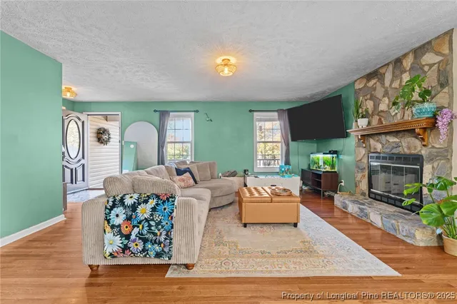 a kitchen with stainless steel appliances granite countertop a stove and a microwave