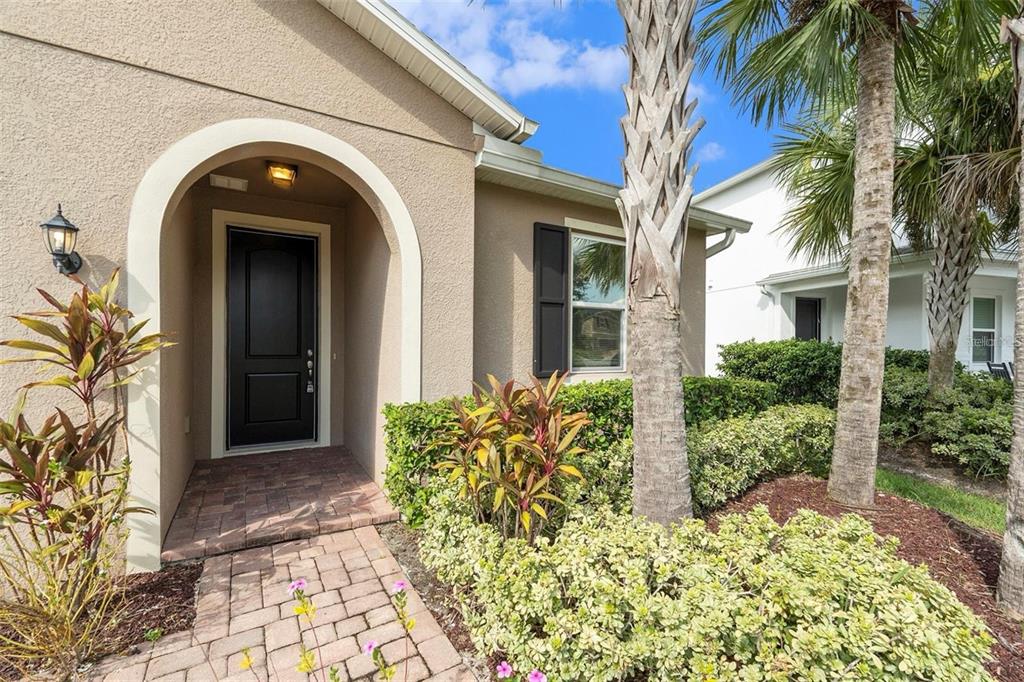 12343 Moss Lake Loop New Port Richey, FL 34655 - Photo 5 of 24 a front view of a house with garden