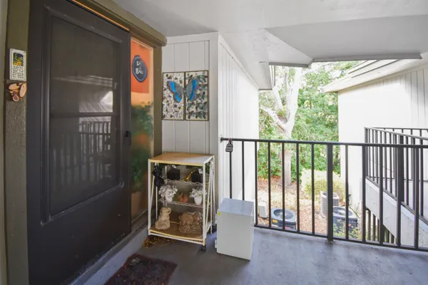 a kitchen with stainless steel appliances a refrigerator a sink and cabinets