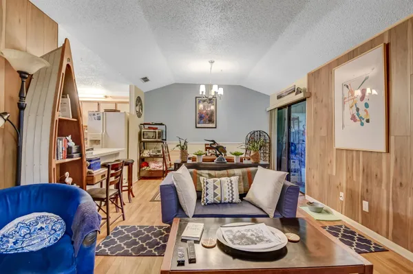 a view of a yard with a large tree