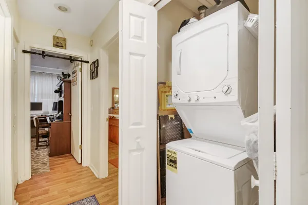 a workspace with furniture a bookshelf and a window