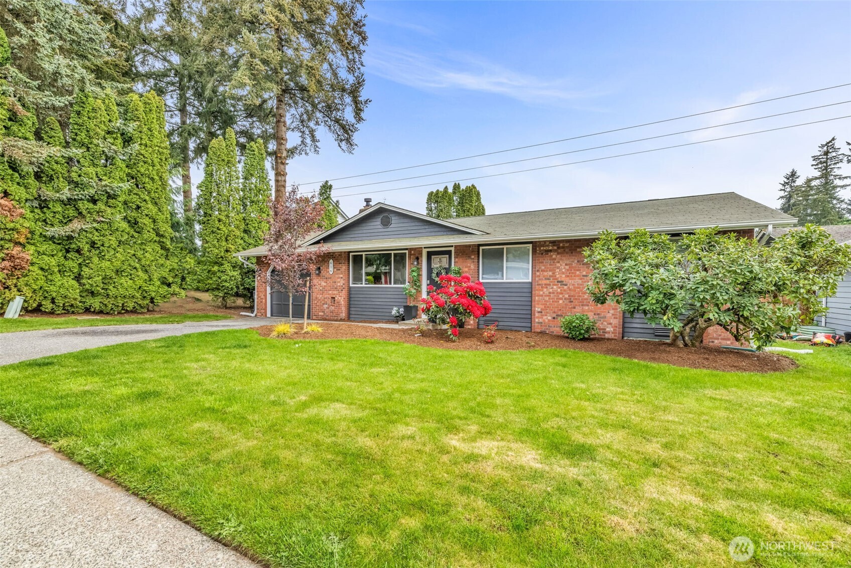 a front view of a house with garden