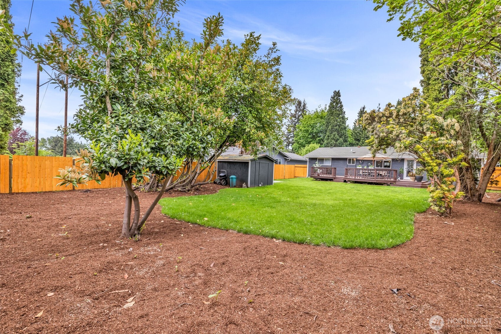 616 212th Street Southwest Bothell, WA 98021 - Photo 9 of 28 a view of a house with a yard and a tree