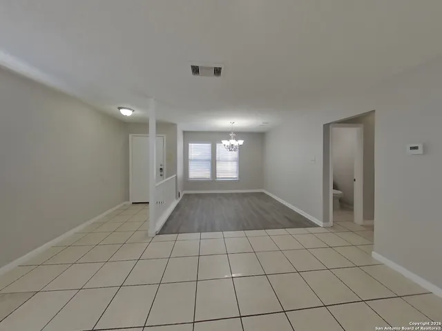 a view of an empty room and window
