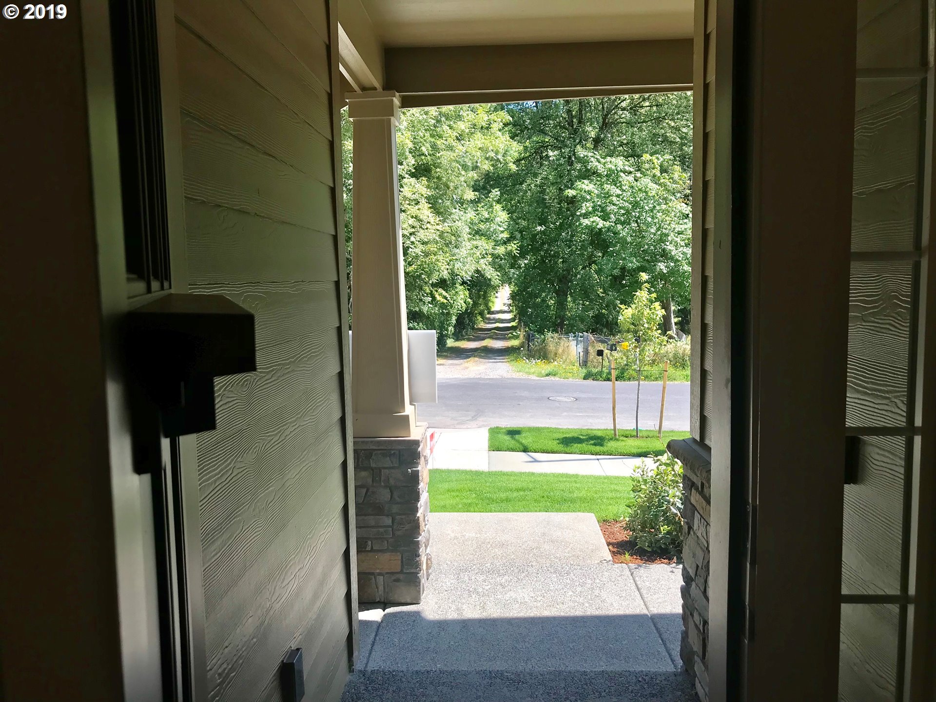 4099 Southwest Rodlun Road Gresham, OR 97080 - Photo 5 of 30 a view of entrance door of the house and yard