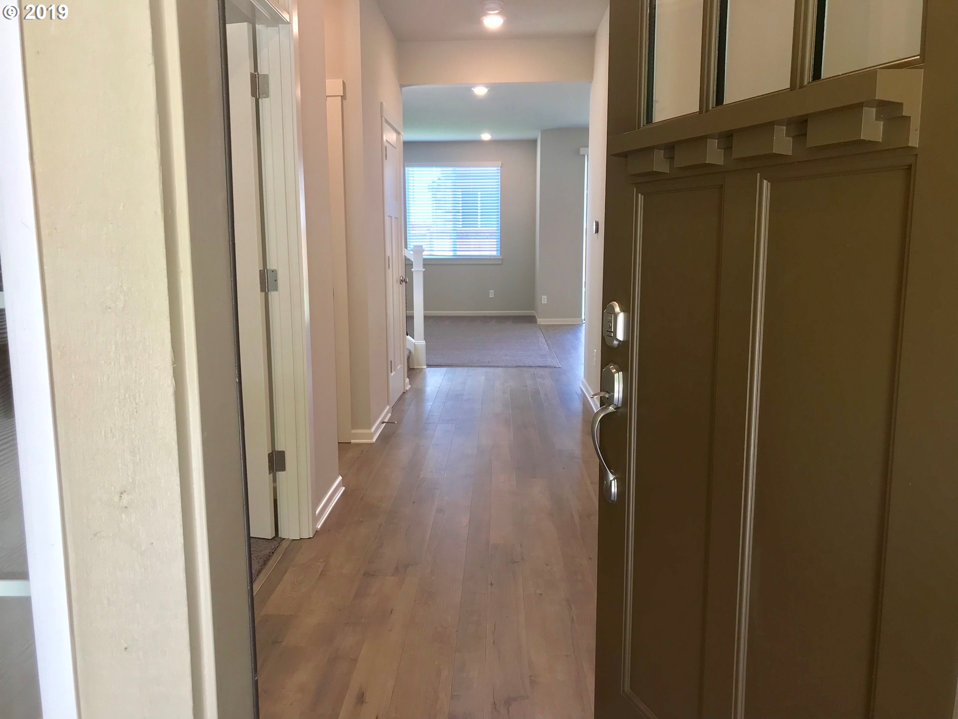 4099 Southwest Rodlun Road Gresham, OR 97080 - Photo 6 of 30 a view of a hallway with wooden floor