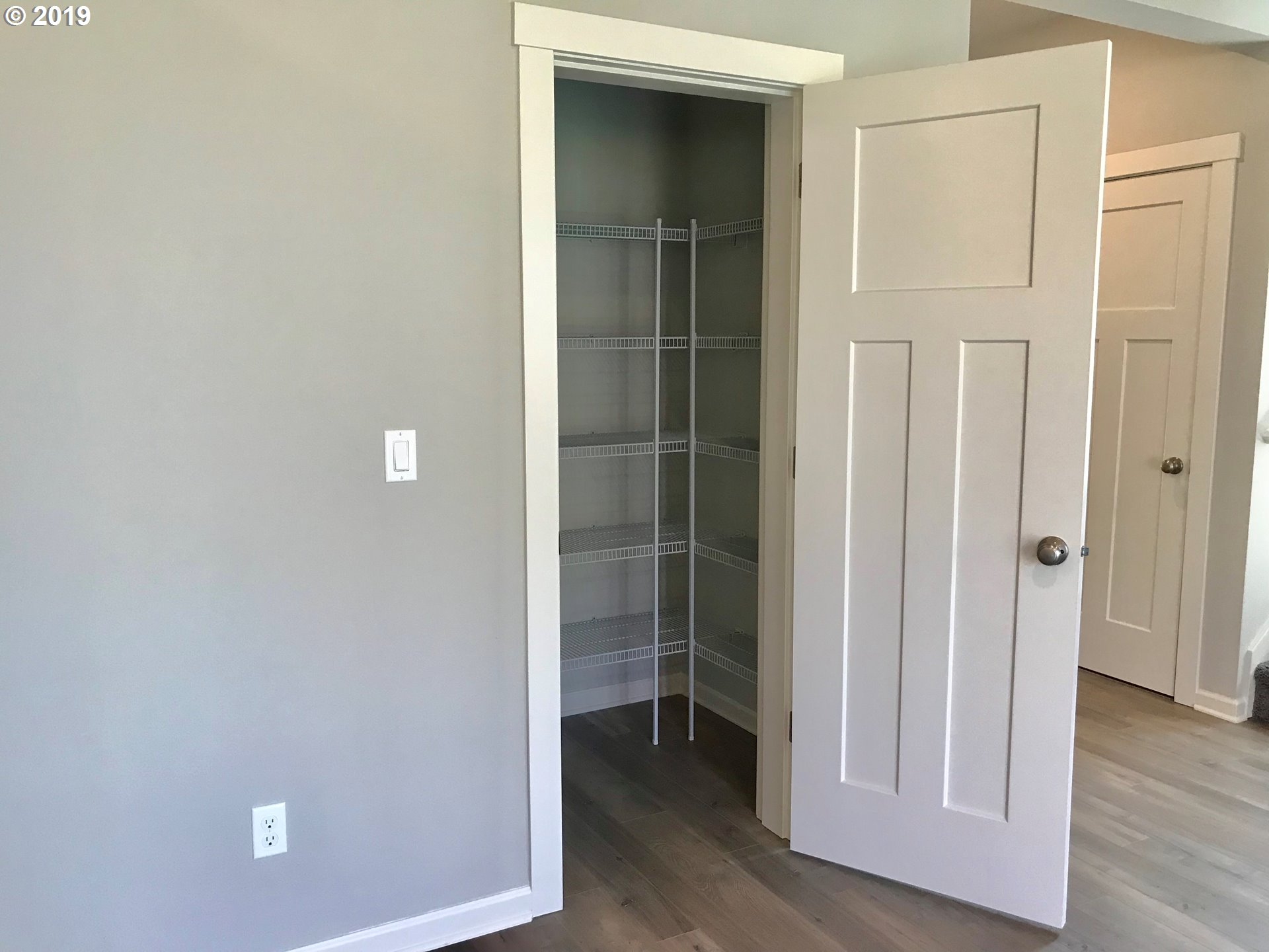 4099 Southwest Rodlun Road Gresham, OR 97080 - Photo 9 of 30 an empty room with wooden floor and closet