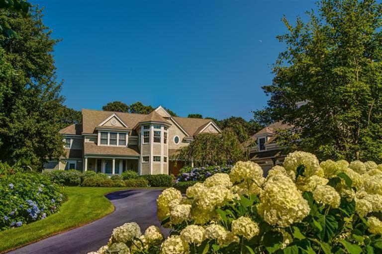 3 Harbor Ridge Road Mashpee, MA 02649 - Photo 1 of 34 a front view of a house with a yard