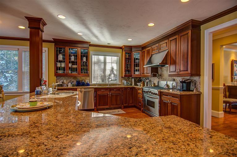 3 Harbor Ridge Road Mashpee, MA 02649 - Photo 11 of 34 a kitchen with stainless steel appliances granite countertop a stove a sink and a refrigerator