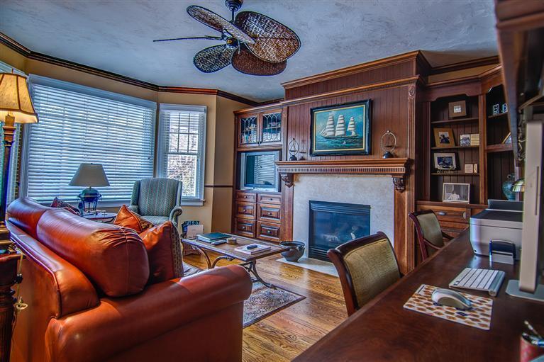 3 Harbor Ridge Road Mashpee, MA 02649 - Photo 17 of 34 a living room with furniture a fireplace and a flat screen tv