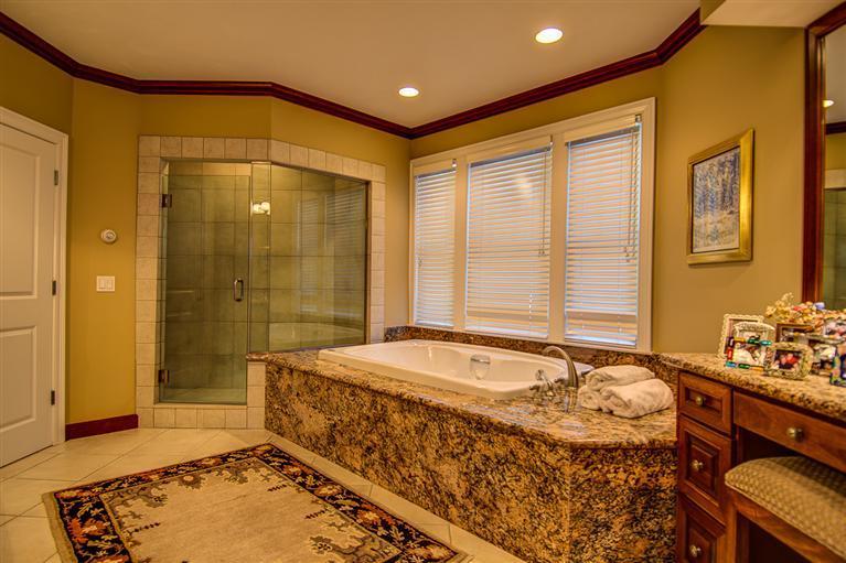 3 Harbor Ridge Road Mashpee, MA 02649 - Photo 20 of 34 a bathroom with a tub sink and shower