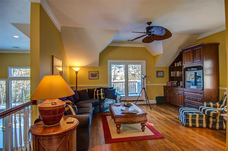 3 Harbor Ridge Road Mashpee, MA 02649 - Photo 22 of 34 a living room with furniture fireplace and a window