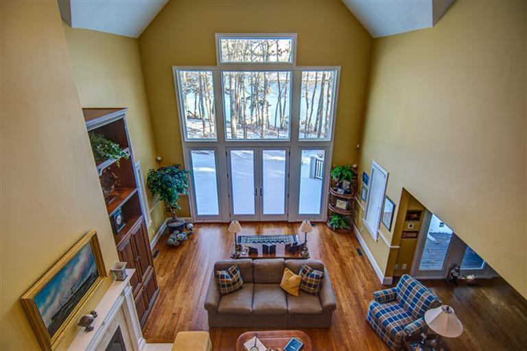 3 Harbor Ridge Road Mashpee, MA 02649 - Photo 24 of 34 a living room with furniture and a floor to ceiling window