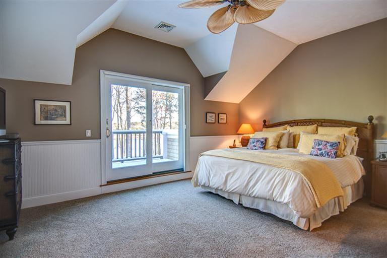 3 Harbor Ridge Road Mashpee, MA 02649 - Photo 25 of 34 a bedroom with a bed lamp and a large window