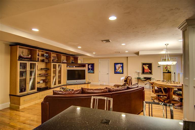 3 Harbor Ridge Road Mashpee, MA 02649 - Photo 28 of 34 a living room with furniture a flat screen tv and a large window