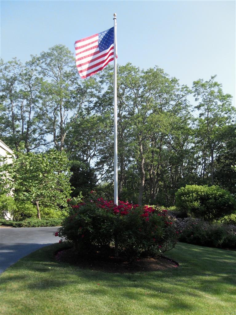 3 Harbor Ridge Road Mashpee, MA 02649 - Photo 33 of 34 a backyard of a house with lots of green space