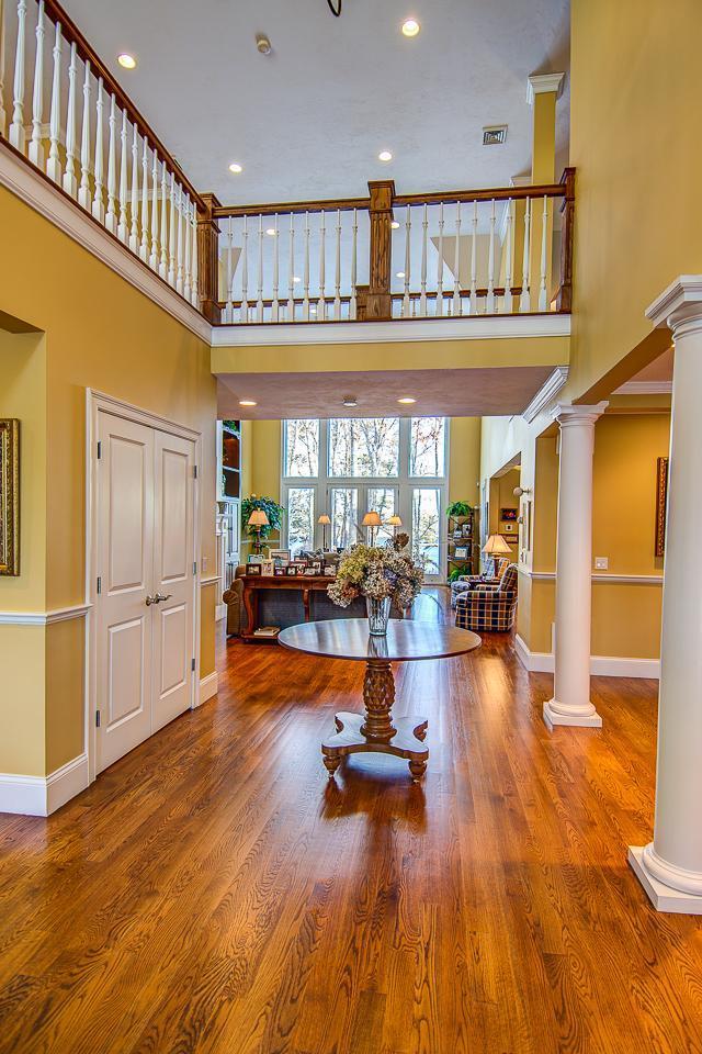 3 Harbor Ridge Road Mashpee, MA 02649 - Photo 8 of 34 a living room with lots of furniture and a dining table with wooden floor