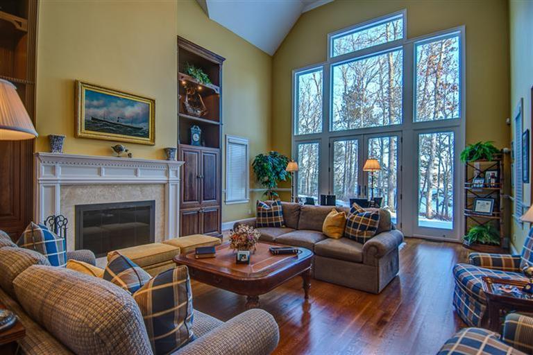 3 Harbor Ridge Road Mashpee, MA 02649 - Photo 10 of 34 a living room with furniture a fireplace and a large window