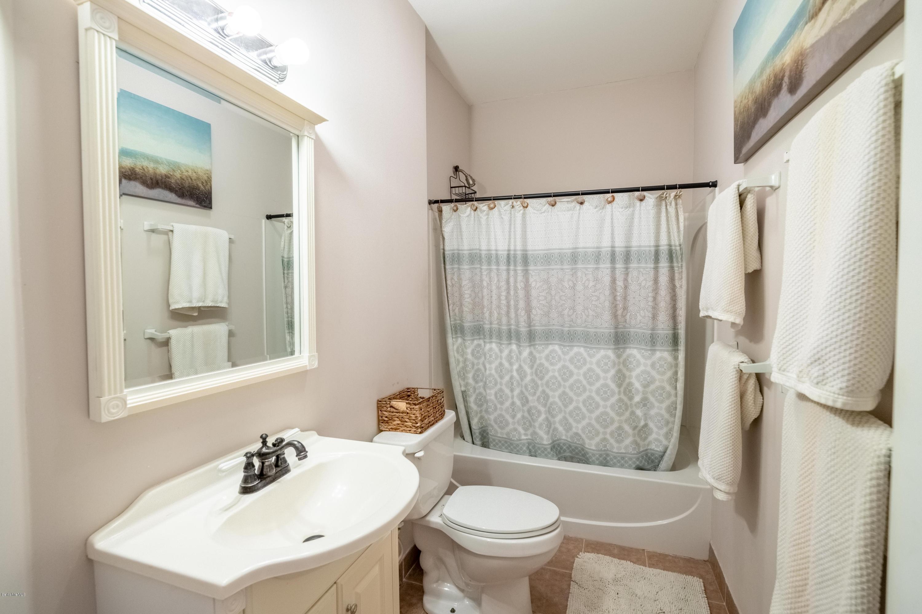 29 Valley View Road Becket, MA 01223 - Photo 11 of 36 a bathroom with a sink toilet and shower