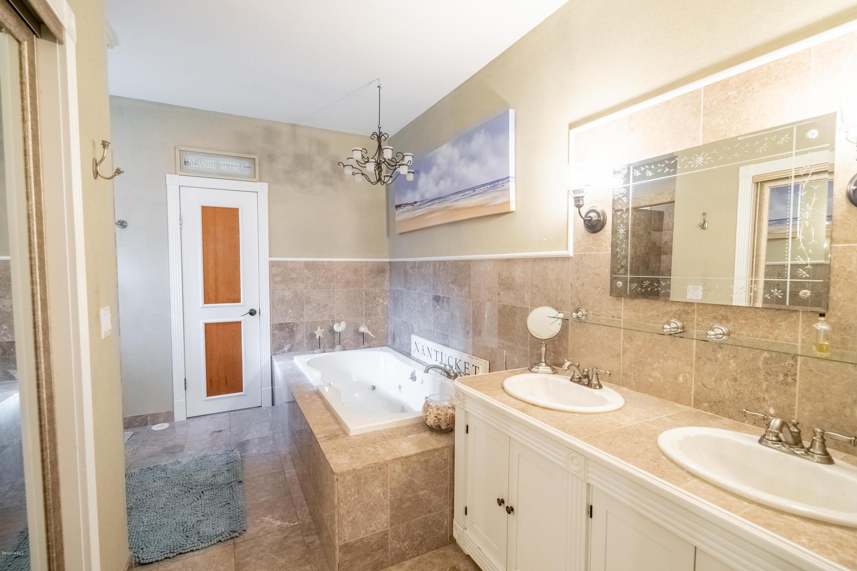 29 Valley View Road Becket, MA 01223 - Photo 18 of 36 a bathroom with a sink and a mirror