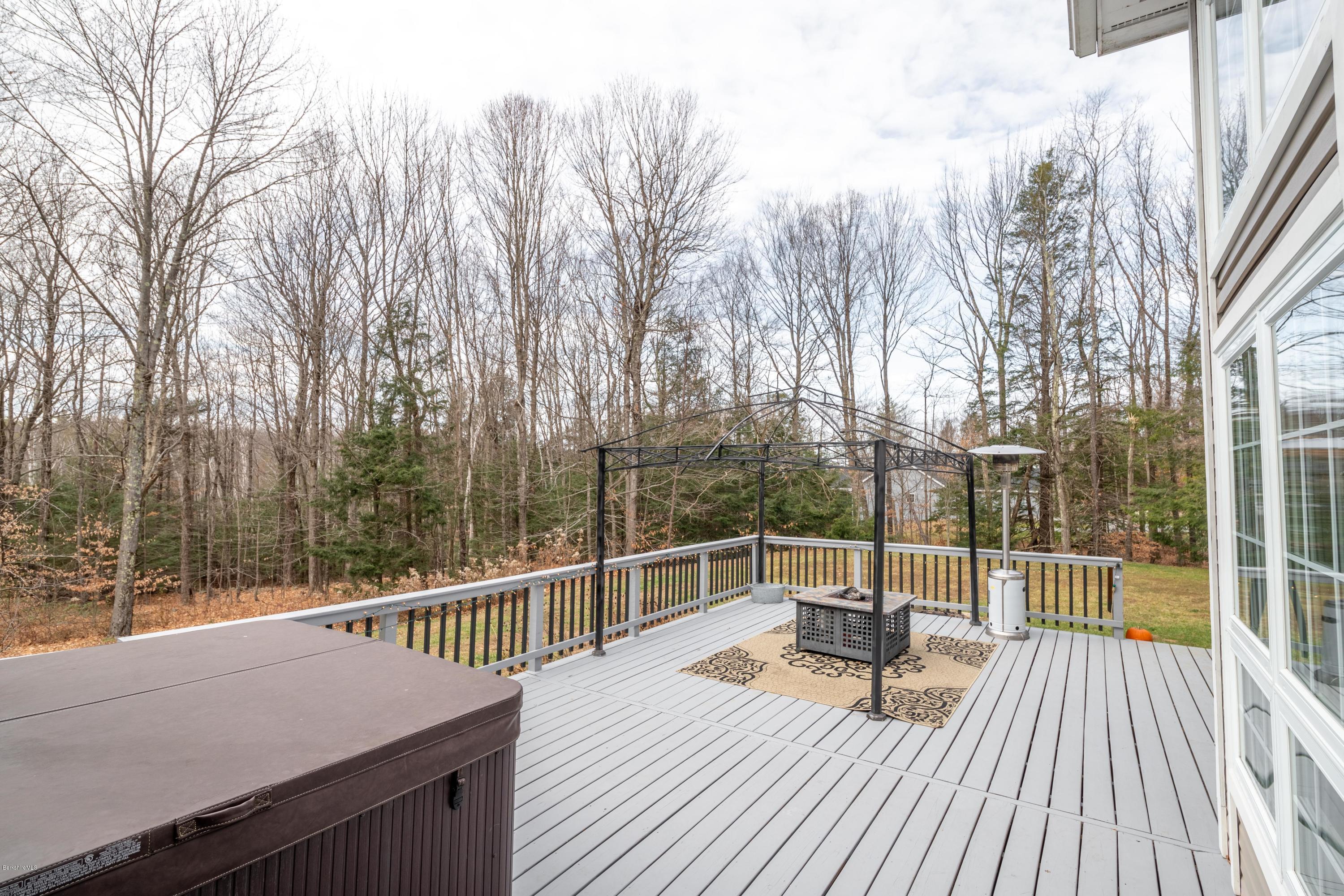 29 Valley View Road Becket, MA 01223 - Photo 4 of 36 a view of a roof deck with wooden floor and fence