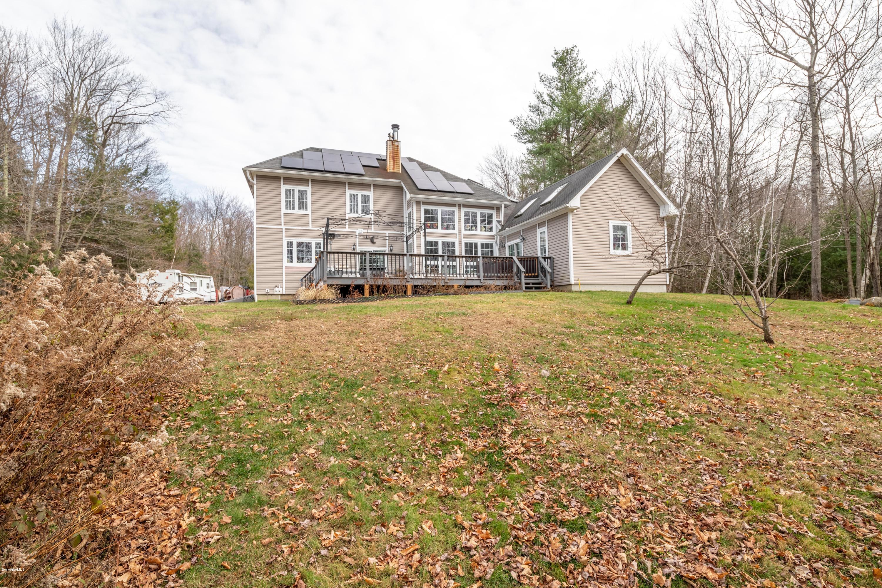 29 Valley View Road Becket, MA 01223 - Photo 34 of 36 a front view of a house with a yard